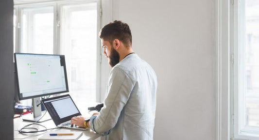 Health Benefits of Height-Adjustable Standing Desks - Sinfinate